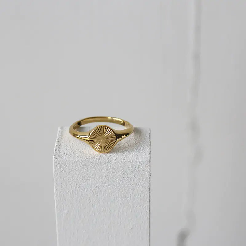 Solar Flare Ring featuring a minimalist gold-plated band with a dainty sunray design. Perfect for everyday elegance and layering with other jewelry.