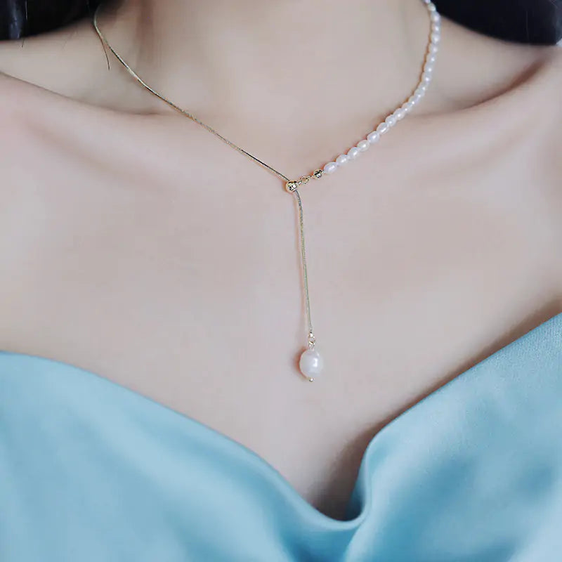 Maren Pearl Necklace featuring lustrous pearls and a delicate gold chain. A timeless and elegant accessory perfect for any occasion.