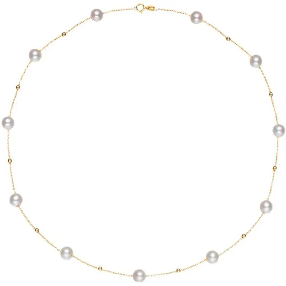 Luna Pearl Necklace featuring delicate gold chain with evenly spaced lustrous pearls, perfect for elegant and timeless styling.