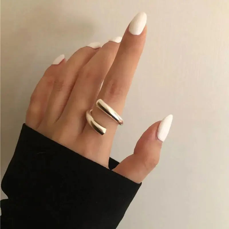 Single Lyra Ring in 925 sterling silver worn on a finger, showcasing its open-ended, minimalist design and polished finish.