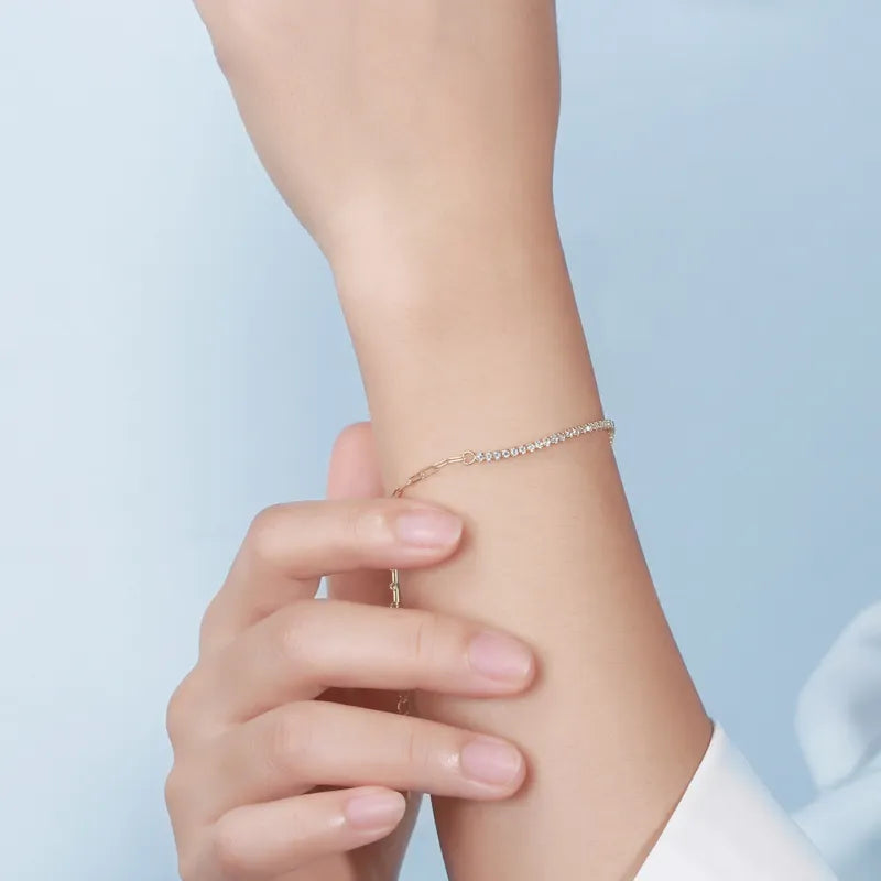 Elysia Bracelet in sterling silver with 4A Zircon inlay, elegantly worn on a woman's wrist. Adjustable and sophisticated jewelry for any occasion.