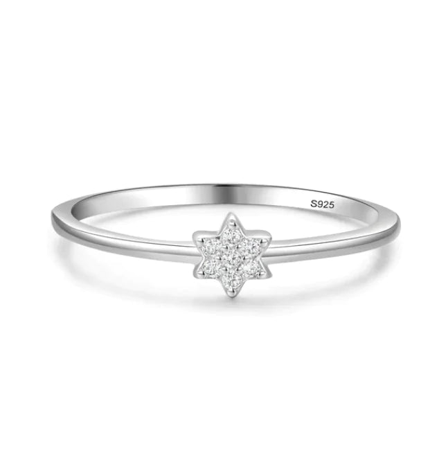 Minimalist sterling silver star ring with cubic zirconia accents. Elegant and timeless jewelry piece for everyday wear or special occasions.